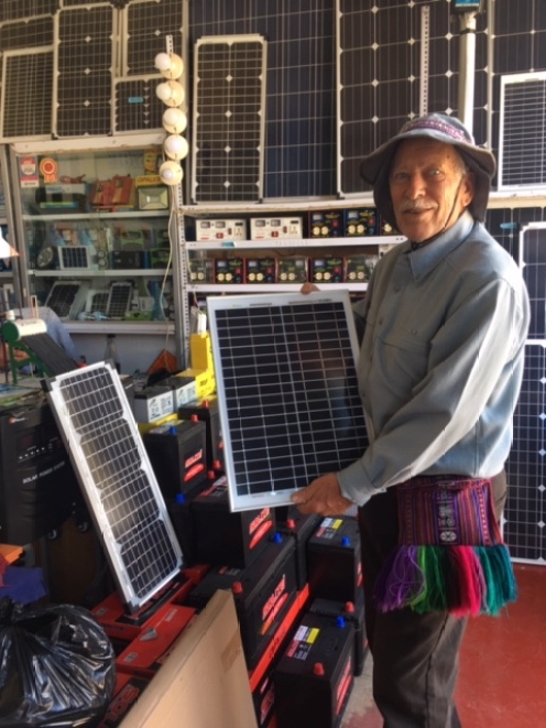 Sam of Paonia Pottery with solar panels